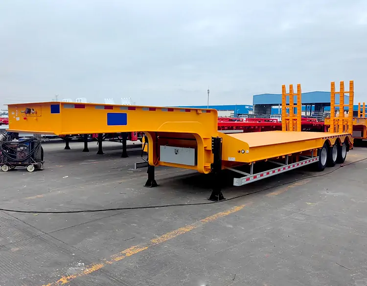 80-Ton 3-Axle Low-Bed Semi-Trailer for Transporting Large Machinery, Exported to Guinea-flatbed trailer_skeletal trailer_low bed trailer_dump trailer_cargo trailer-Shandong Jiuzhou Automobile Manufacturing Co., Ltd. 80-Ton 3-Axle Low-Bed Semi-Trailer for Transporting Large Machinery, Exported to Guinea-flatbed trailer_skeletal trailer_low bed trailer_dump trailer_cargo trailer-Shandong Jiuzhou Automobile Manufacturing Co., Ltd.