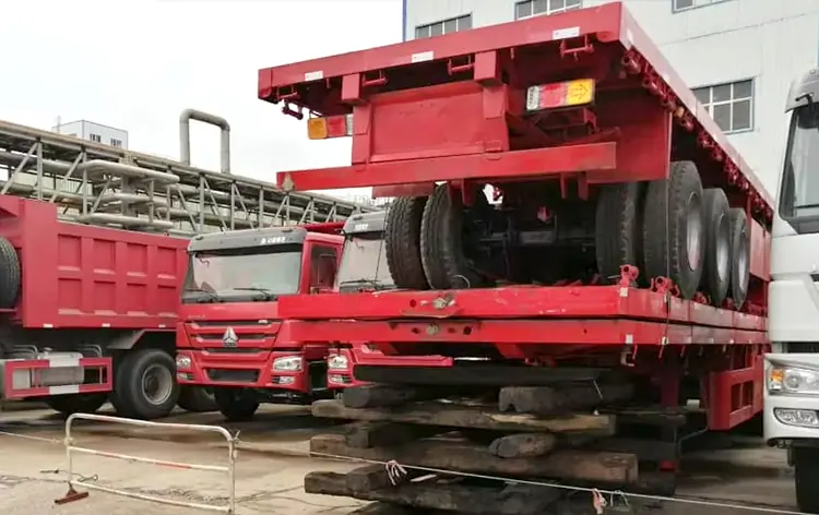 3 Axle Flatbed Semi-Trailer Shipped to Tanzania-flatbed trailer_skeletal trailer_low bed trailer_dump trailer_cargo trailer-Shandong Jiuzhou Automobile Manufacturing Co., Ltd. 3 Axle Flatbed Semi-Trailer Shipped to Tanzania-flatbed trailer_skeletal trailer_low bed trailer_dump trailer_cargo trailer-Shandong Jiuzhou Automobile Manufacturing Co., Ltd.